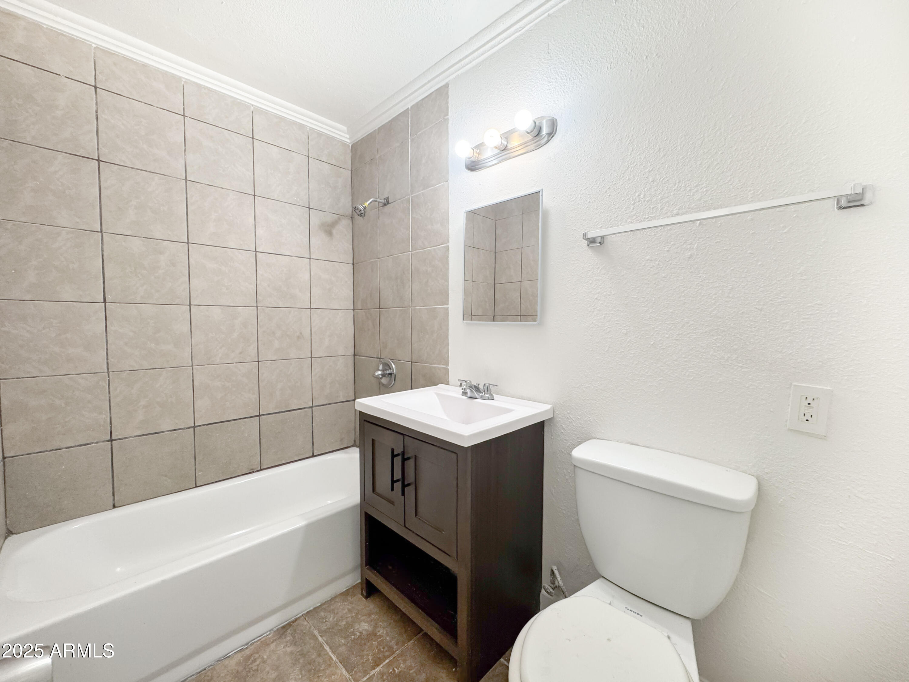 3422 East Culver Street Phoenix, AZ 85008 - Photo 11 of 25 a bathroom with a sink a toilet and bathtub