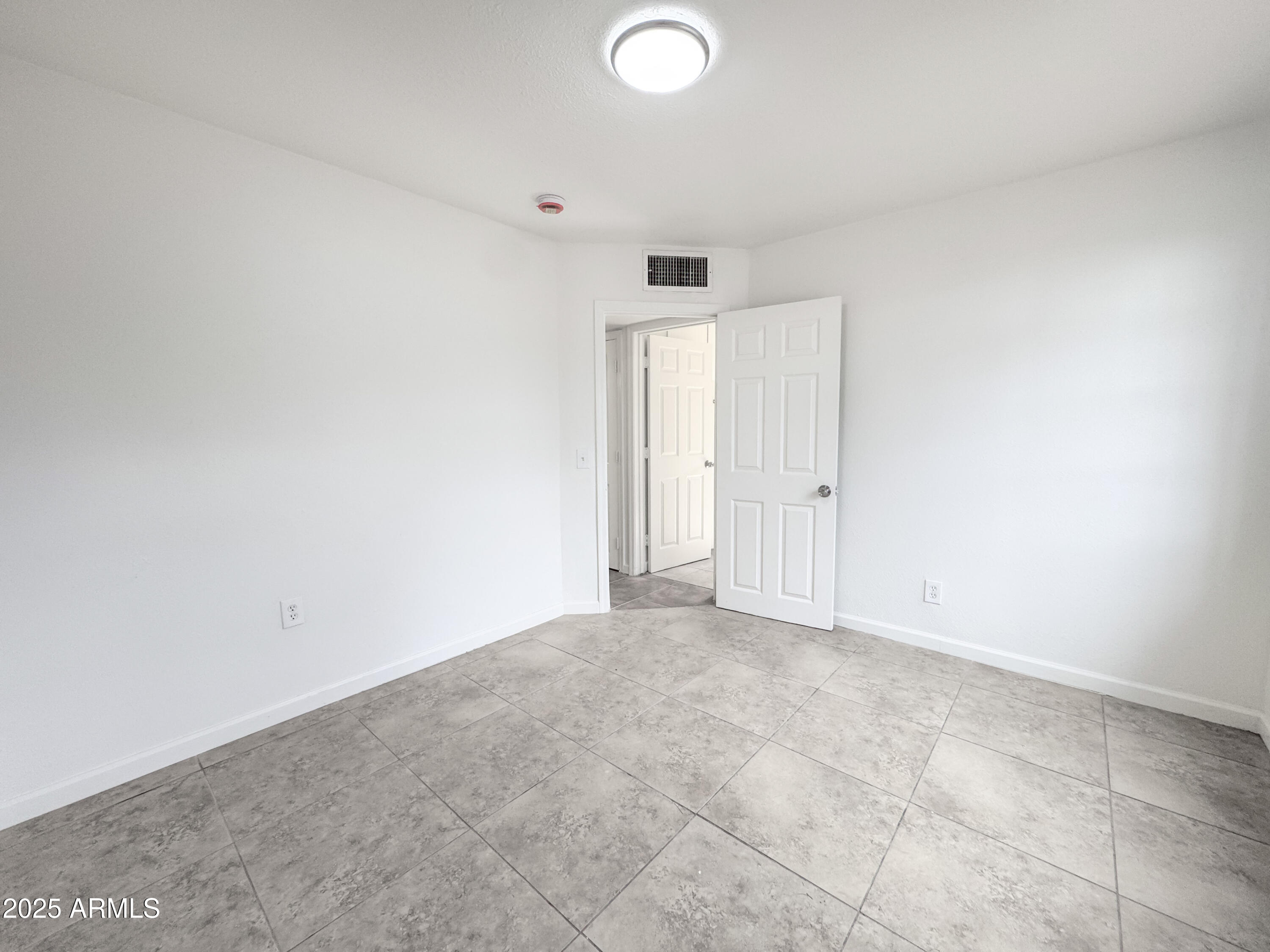 3422 East Culver Street Phoenix, AZ 85008 - Photo 16 of 25 an empty room with an entryway