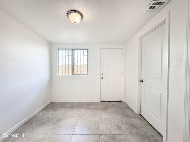 an empty room with an entryway