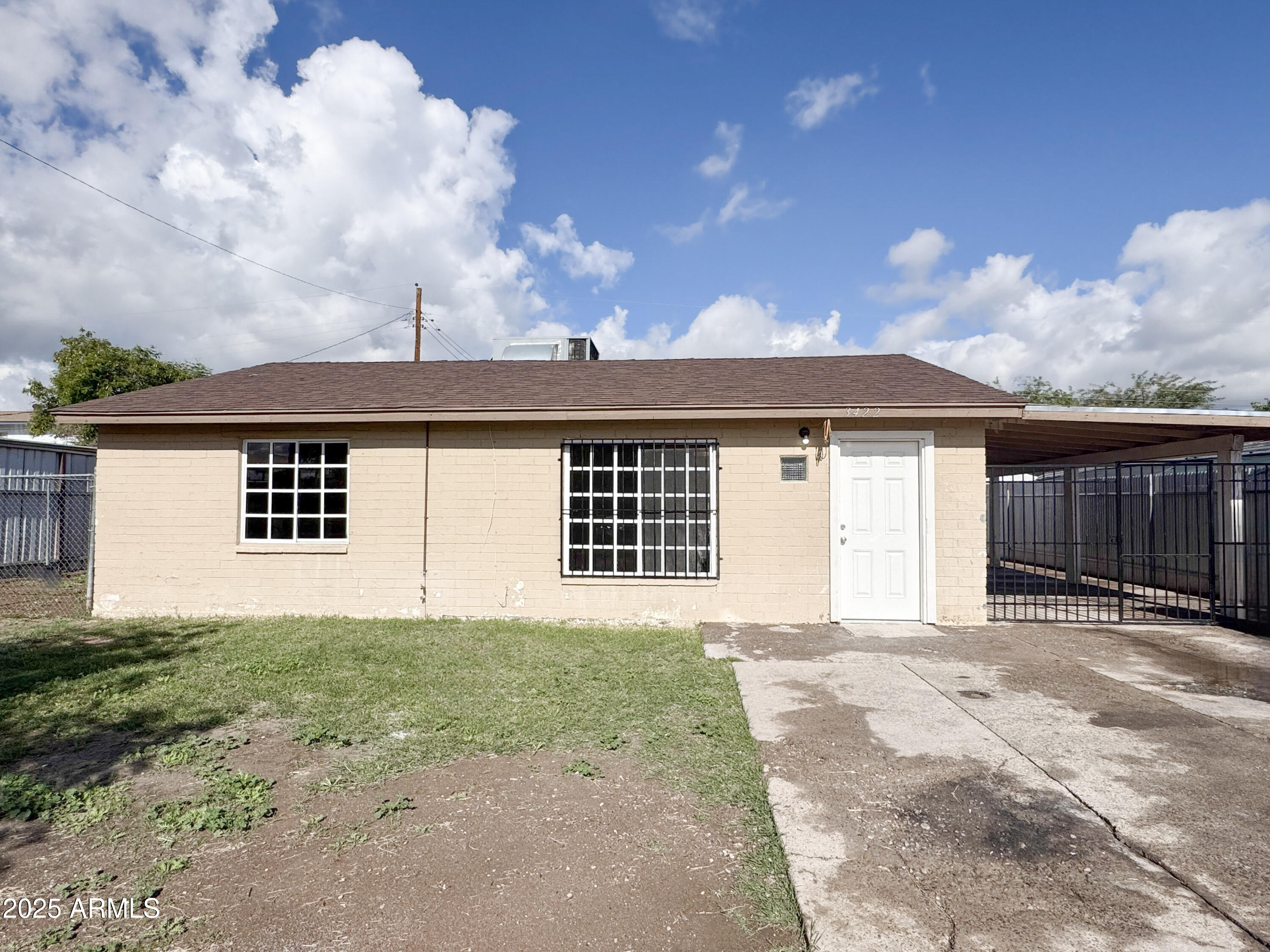 3422 East Culver Street Phoenix, AZ 85008 - Photo 2 of 25 a front view of a house with a yard and garage