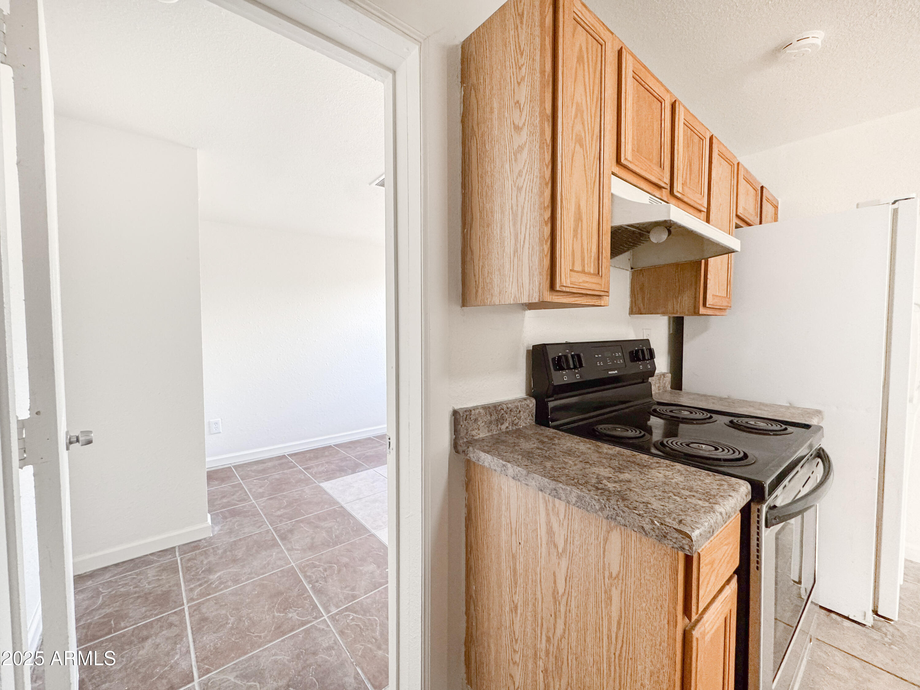 3422 East Culver Street Phoenix, AZ 85008 - Photo 9 of 25 a kitchen with stainless steel appliances granite countertop a stove a sink and a microwave