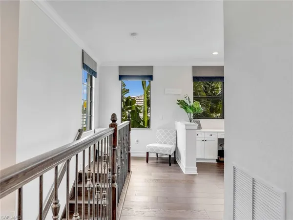 a view of a livingroom with furniture and stairs