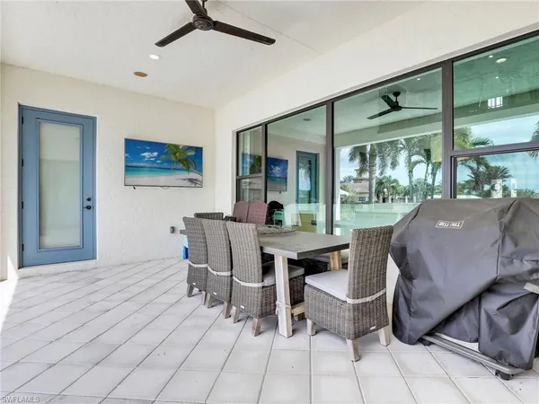 a dining room with furniture and window