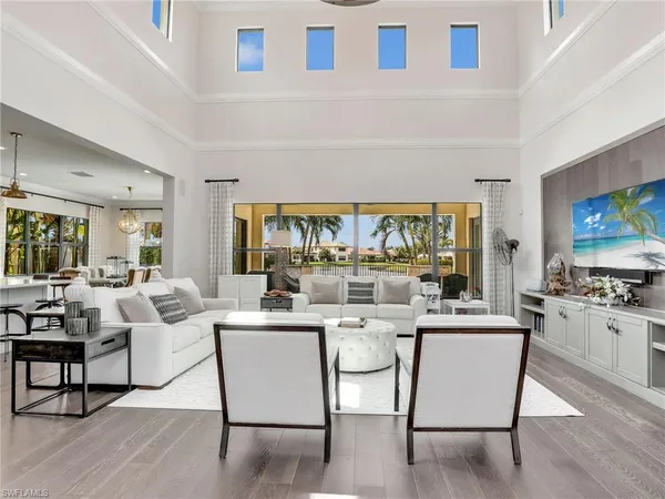 a living room with fireplace furniture and a flat screen tv