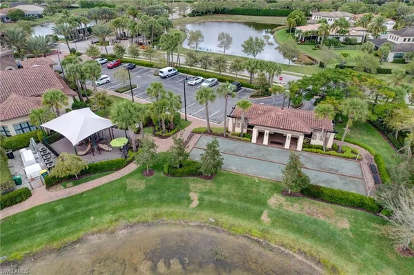 an aerial view of multiple houses with yard