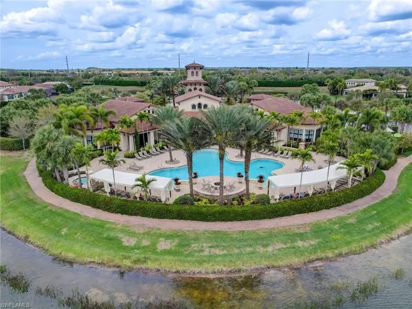 an aerial view of a house with a garden and trees
