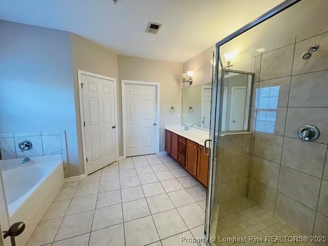 a bathroom with a shower and a bathtub