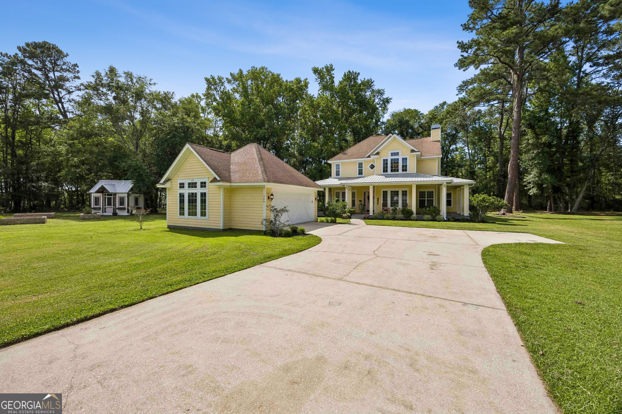706 Hopewell Point Road White Oak, GA 31568 - Photo 49 of 84 A sweeping driveway leads to a home designed for both everyday living and entertaining, with abundant outdoor space surrounding the property.