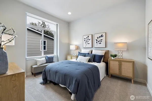 a bed room with a bed and a night stand