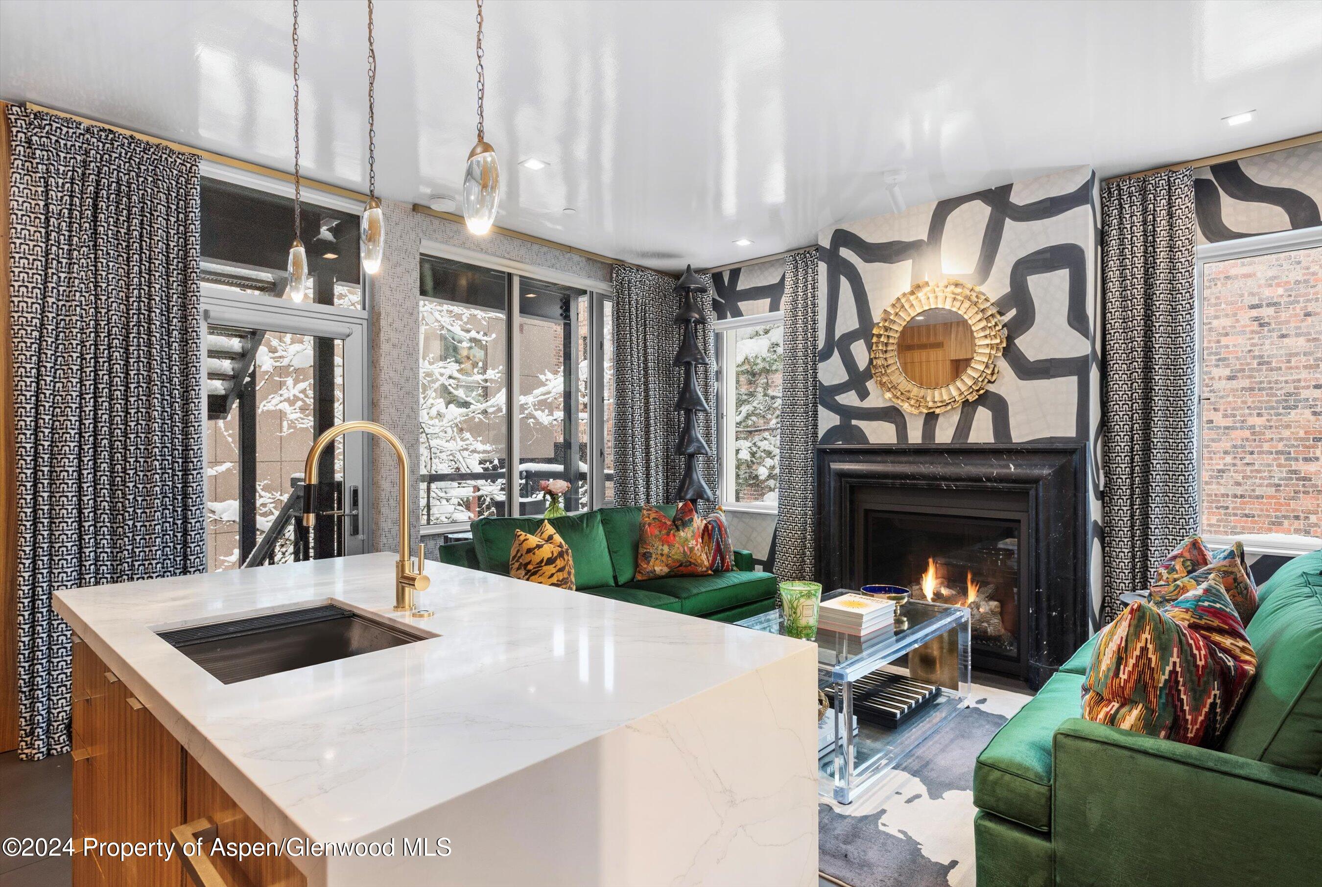 434 East Main Street, Unit 203 Aspen, CO 81611 - Photo 5 of 22 a living room with fireplace furniture and a fireplace