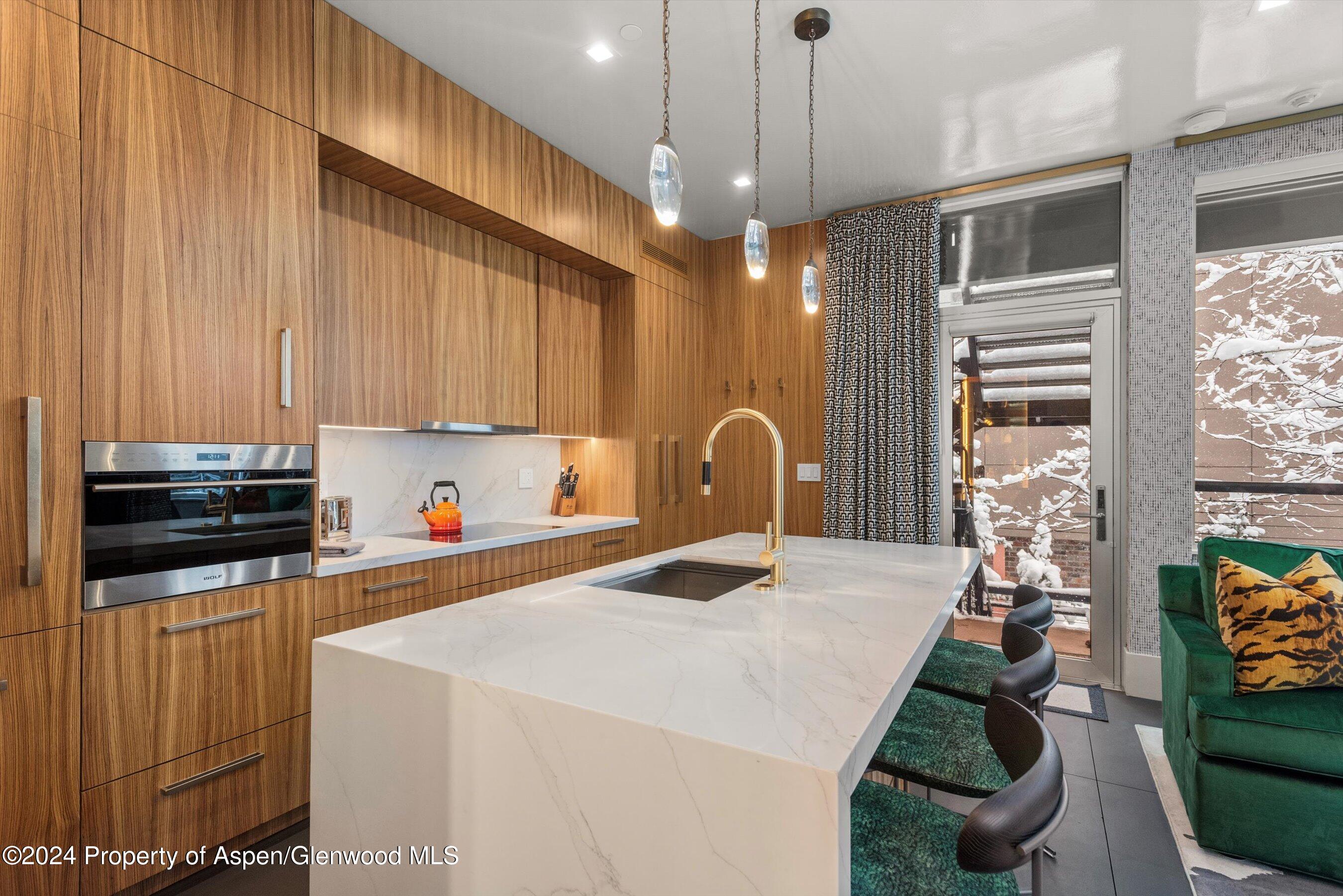 434 East Main Street, Unit 203 Aspen, CO 81611 - Photo 7 of 22 a very nice looking room with a large window