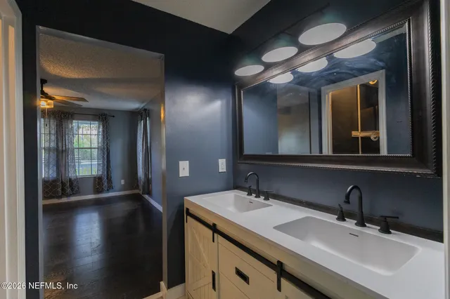 a bathroom with a sink and a mirror