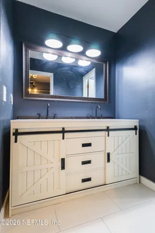 a bathroom with a sink and a mirror