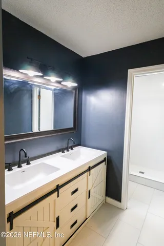 a bathroom with a shower and toilet