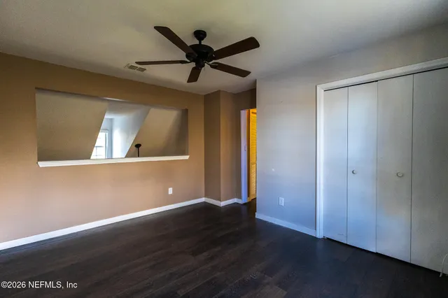 a bathroom with a sink a toilet and shower curtain