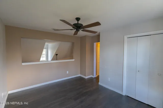 a view of an entryway with wooden floor