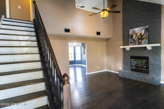 a view of an entryway with wooden floor