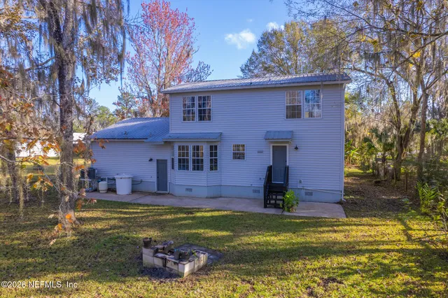 an aerial view of house with outdoor space