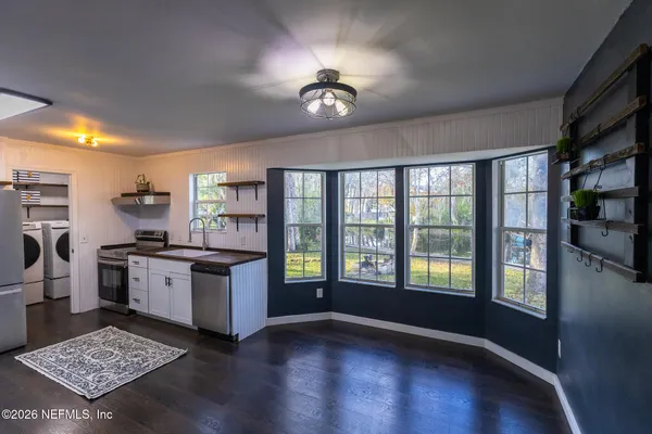 a kitchen with cabinets and stainless steel appliances