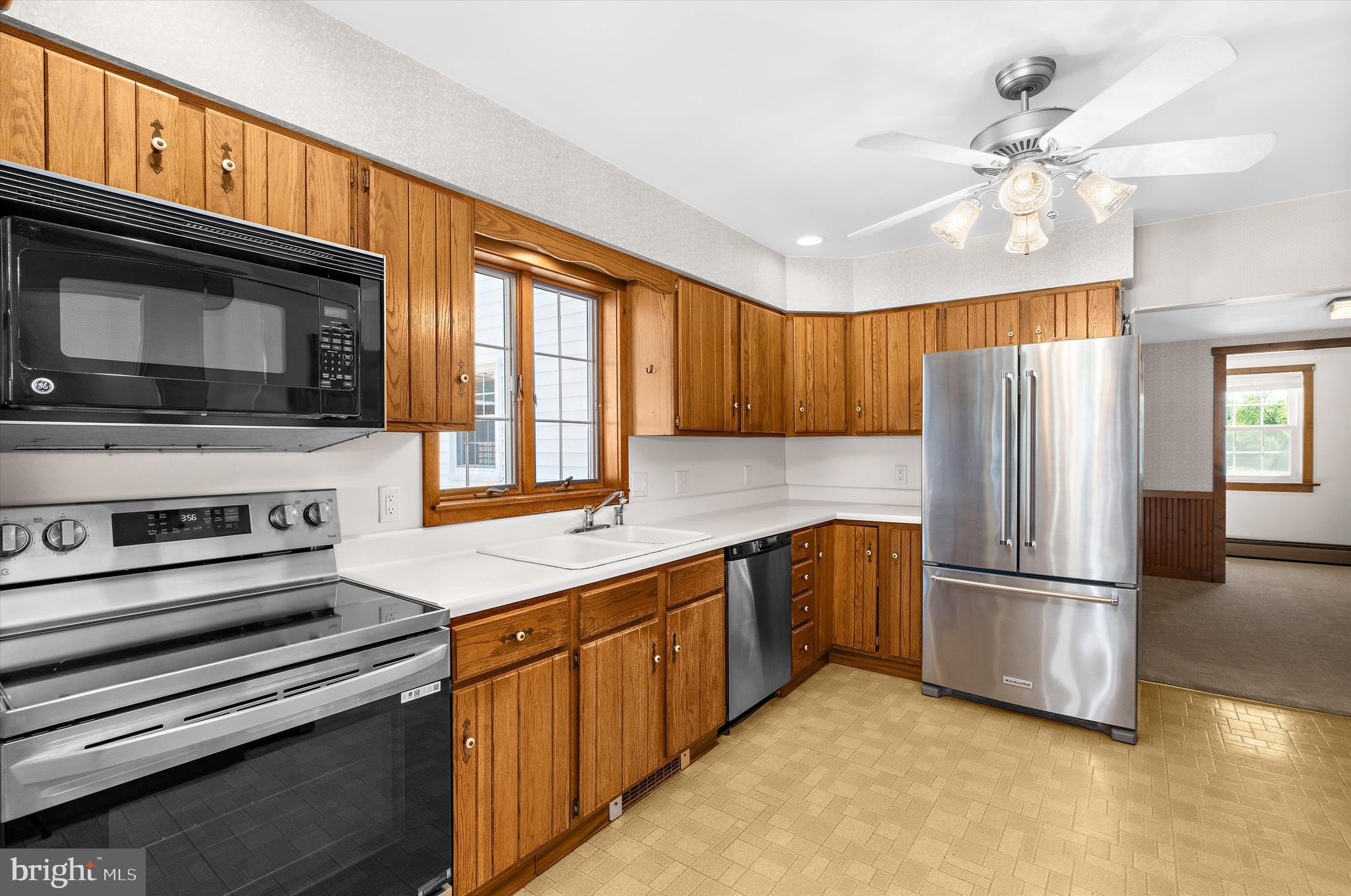 12714 Still Pond Road Still Pond, MD 21667 - Photo 8 of 62 a kitchen with stainless steel appliances granite countertop a refrigerator a stove a sink and a microwave