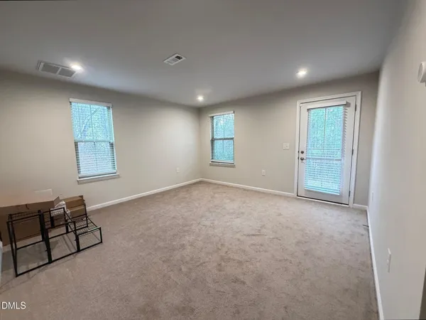 a view of an empty room and window