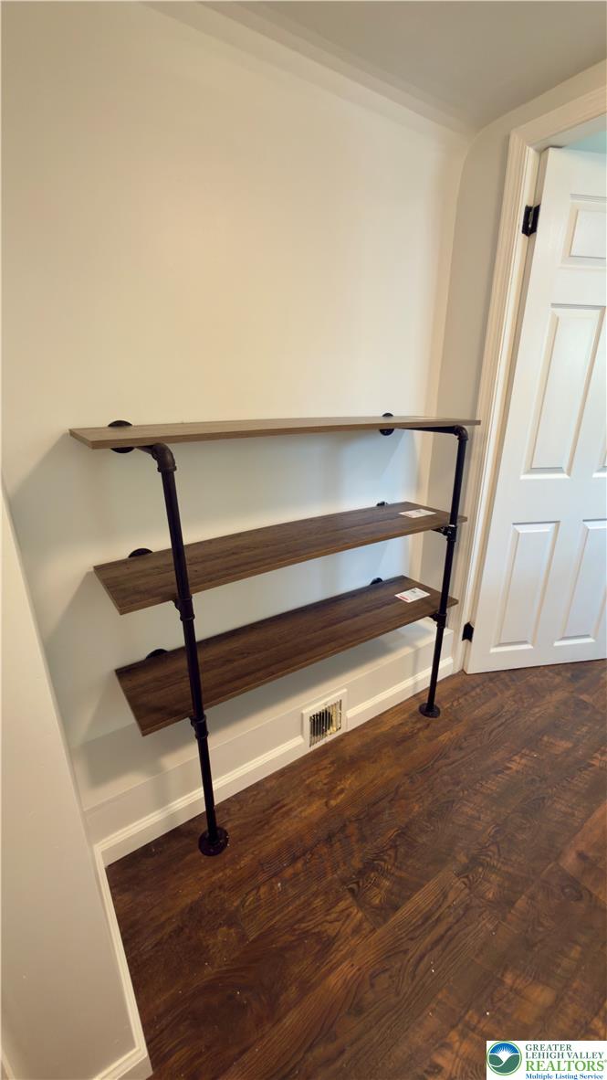 246 Poplar Street Bath, PA 18014 - Photo 26 of 34 Functional built-in shelving offers smart storage solutions, complementing the rich wood flooring.