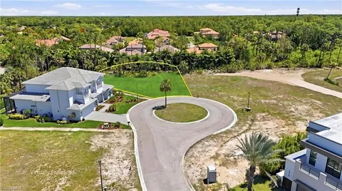 an aerial view of a house with garden space lake view and mountain view