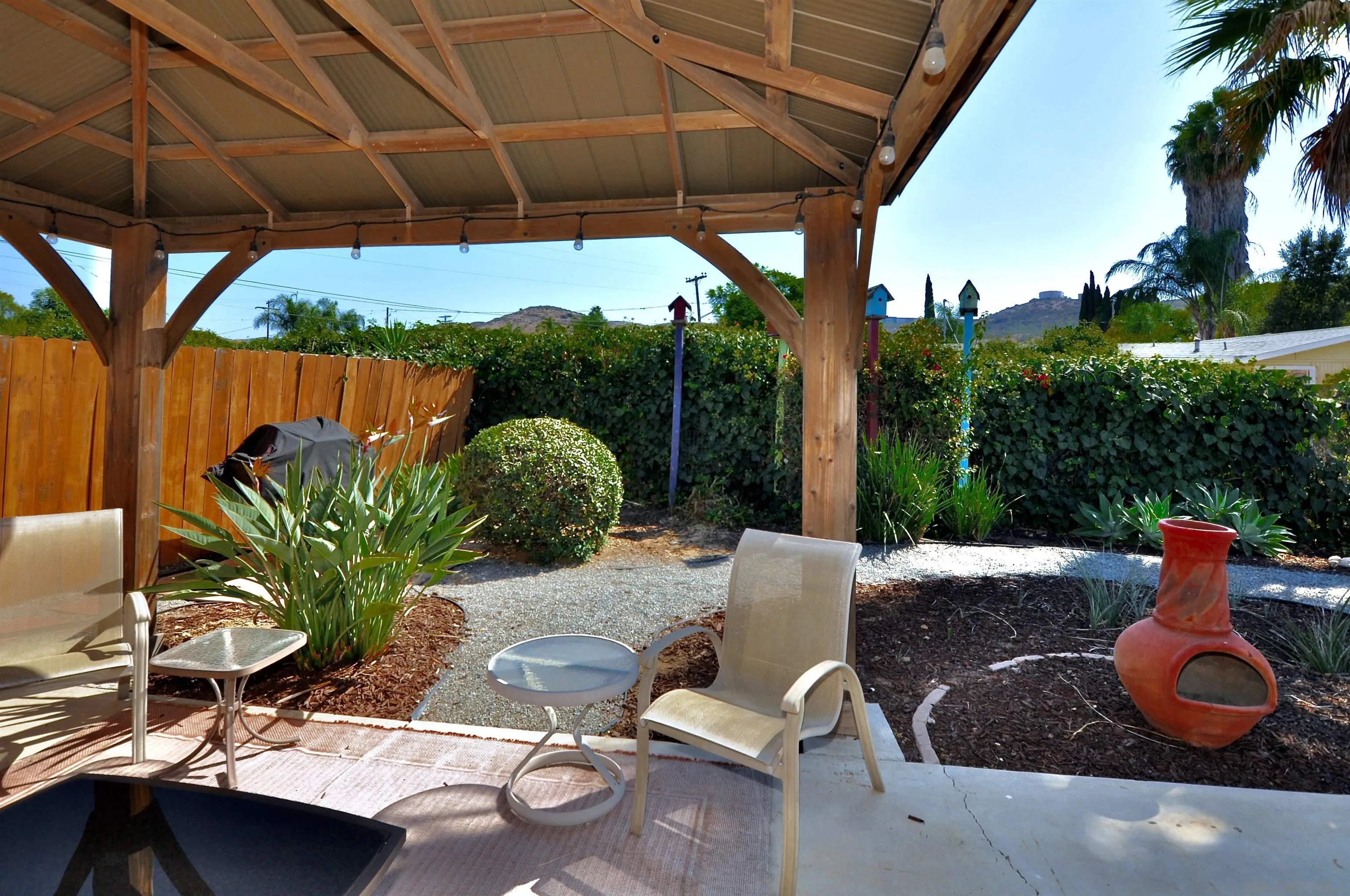 14333 Lolin Lane Poway, CA 92064 - Photo 11 of 41 a view of backyard with outdoor seating and plants