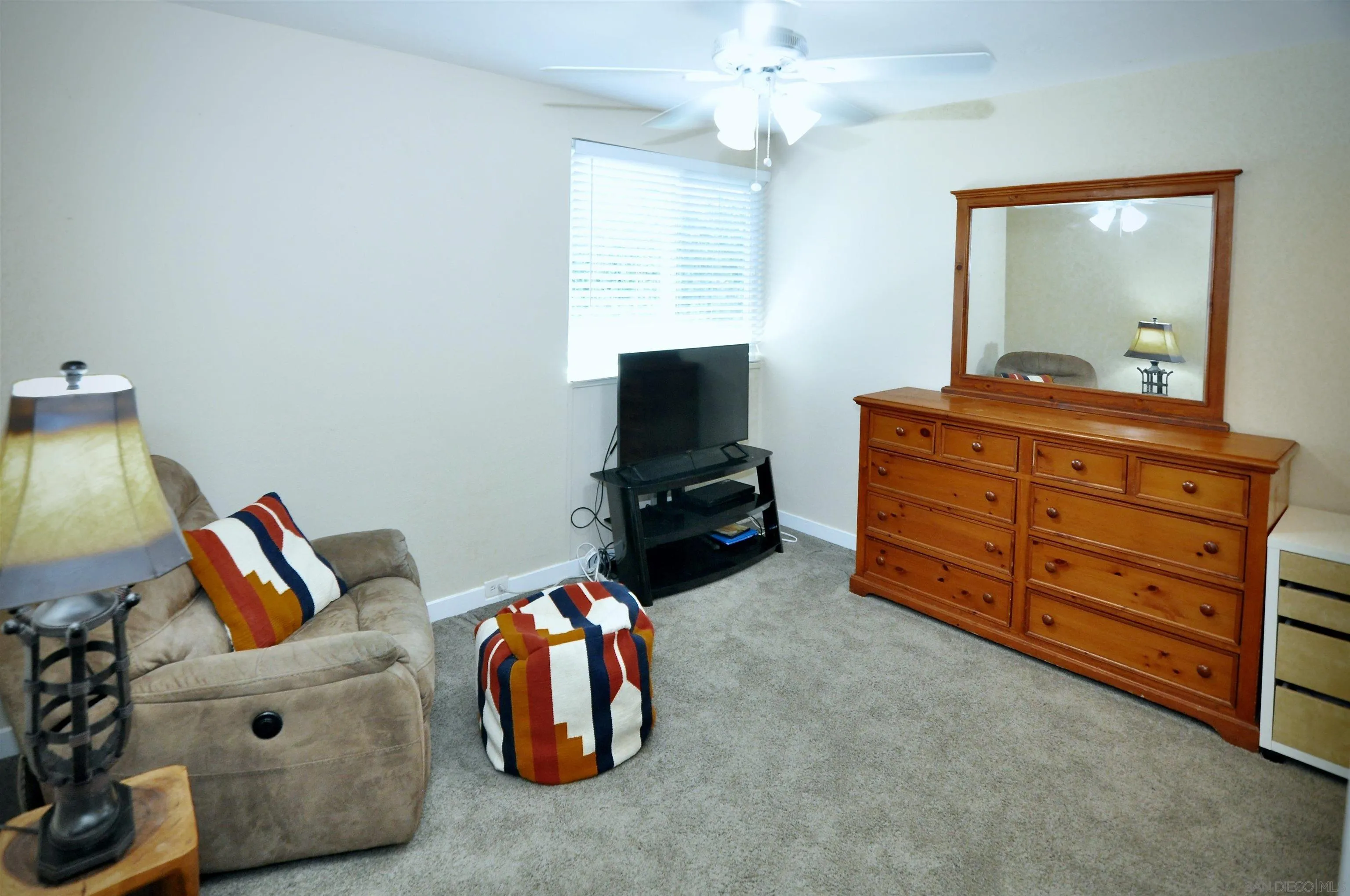 14333 Lolin Lane Poway, CA 92064 - Photo 17 of 41 a bedroom with a bed and furniture