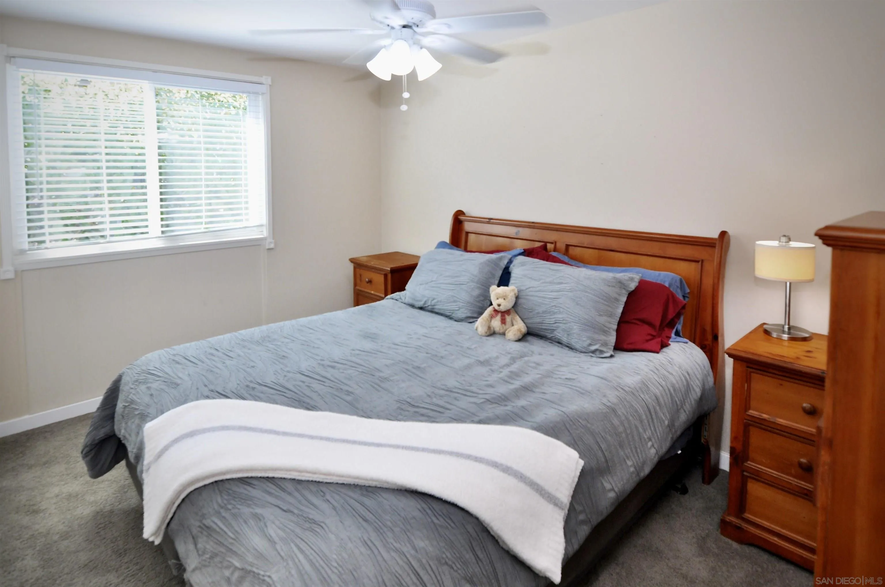 14333 Lolin Lane Poway, CA 92064 - Photo 19 of 41 a bedroom with a bed and a window