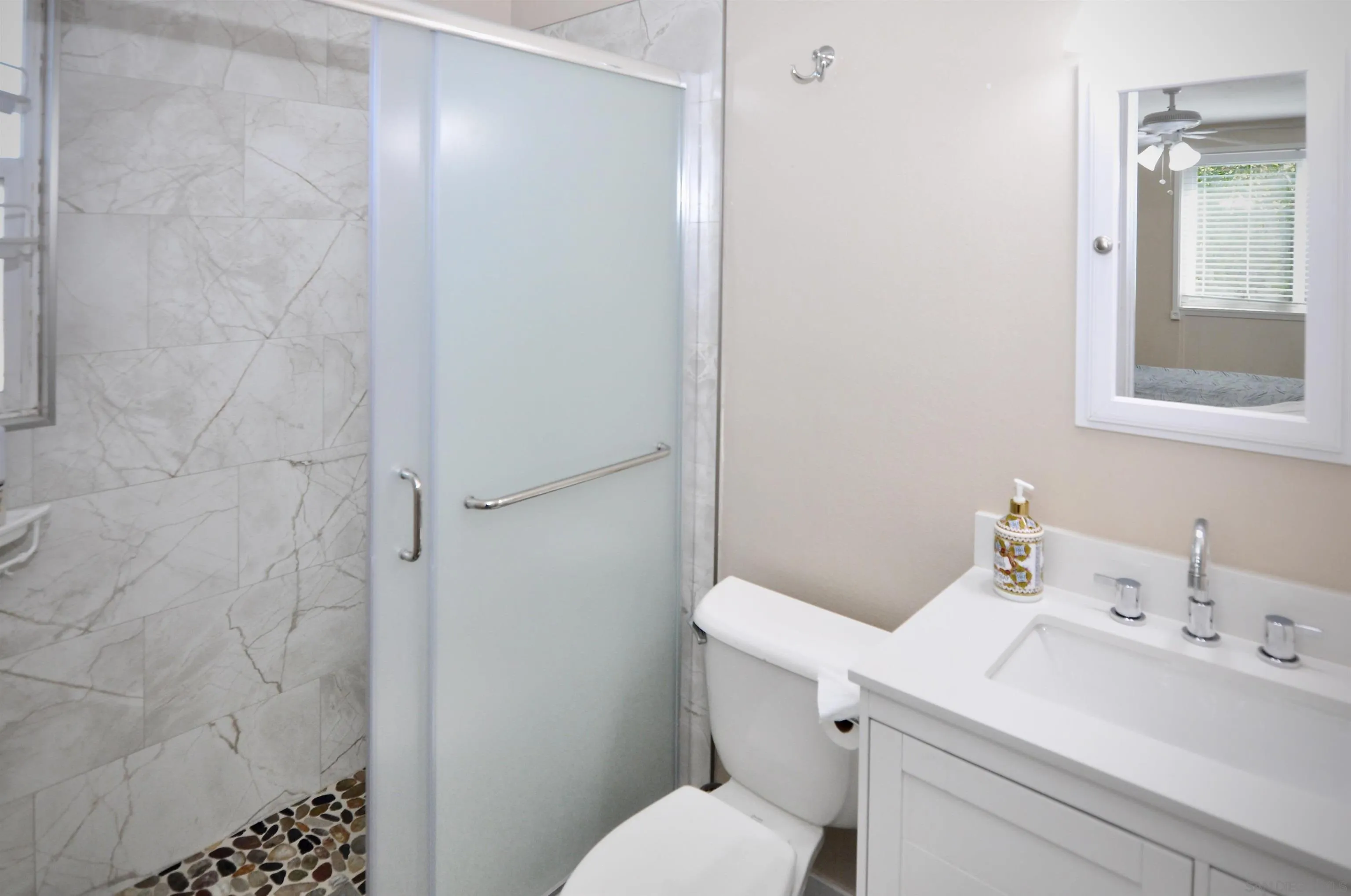 14333 Lolin Lane Poway, CA 92064 - Photo 23 of 41 a bathroom with a sink and a toilet