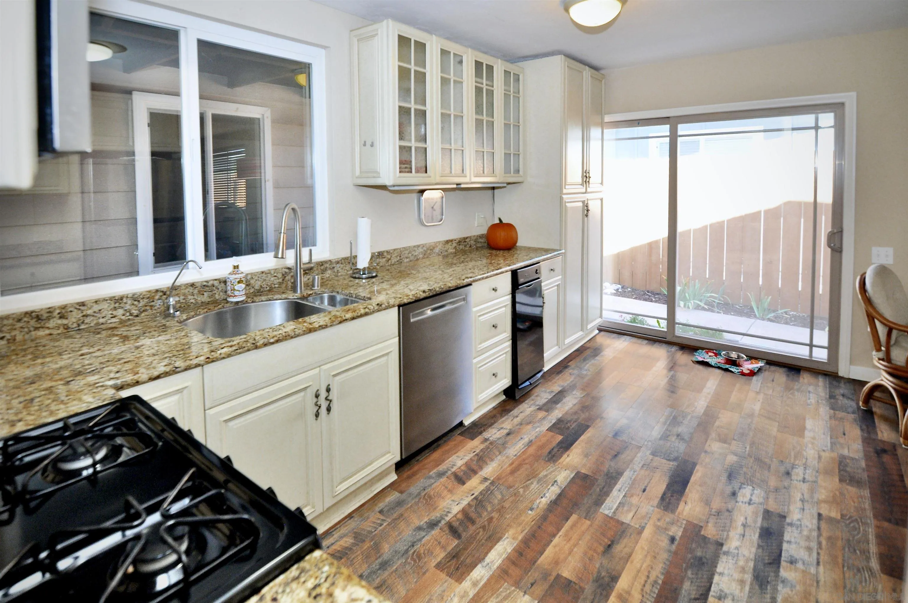 14333 Lolin Lane Poway, CA 92064 - Photo 34 of 41 a kitchen with a sink stove and cabinets