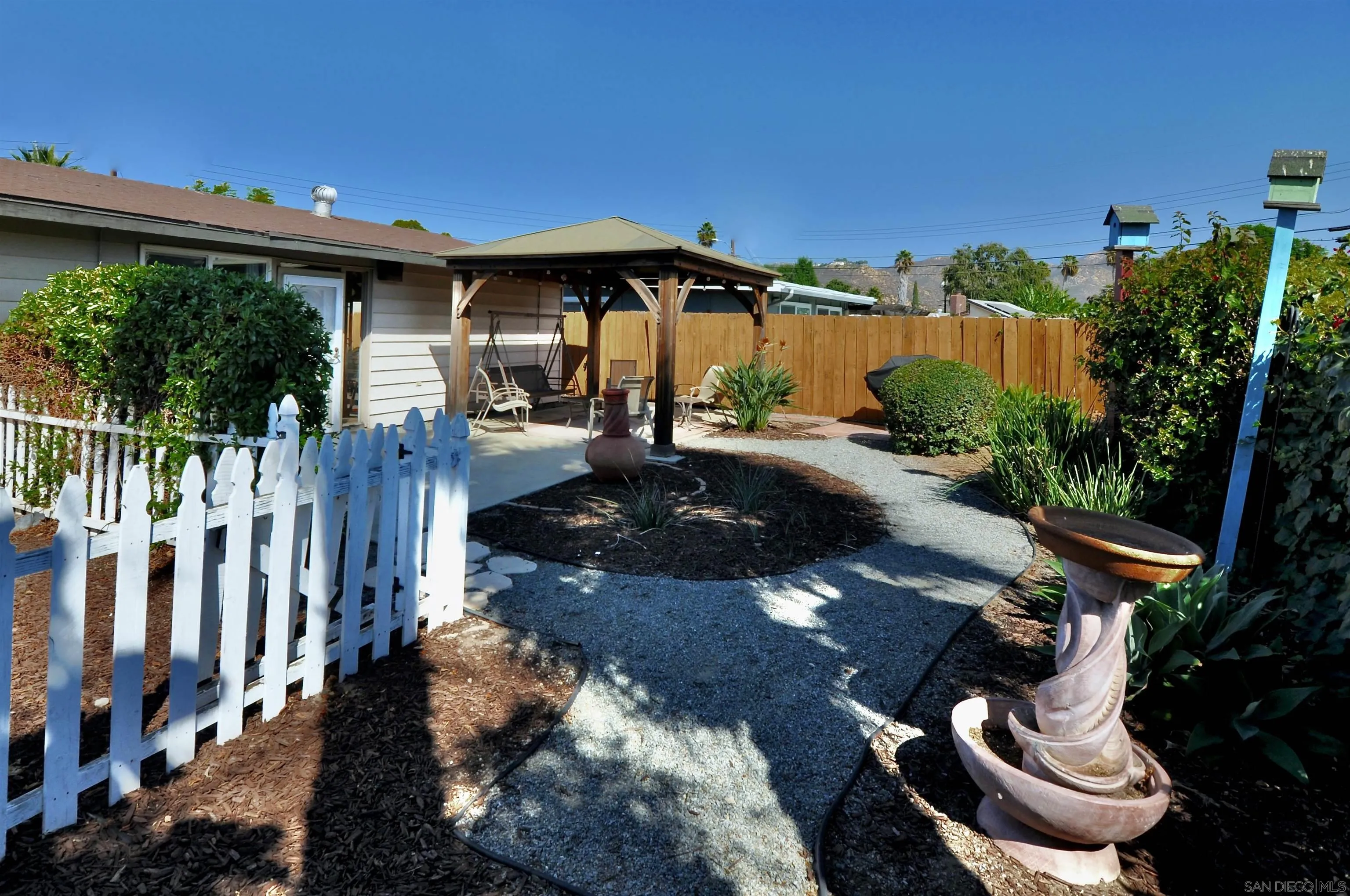 14333 Lolin Lane Poway, CA 92064 - Photo 39 of 41 a view of a chairs and table in backyard