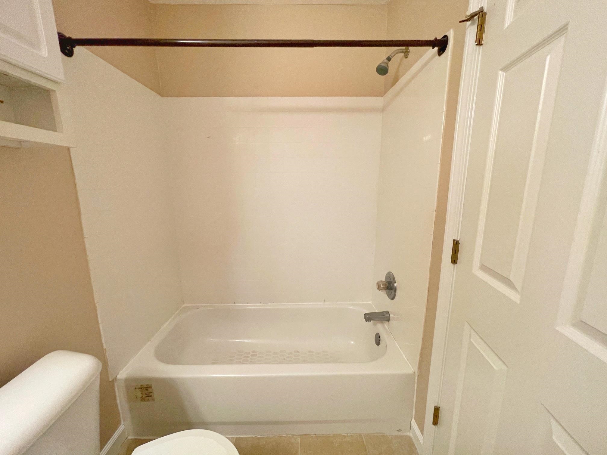 4420 Carter Road, Unit 35 St. Augustine, FL 32086 - Photo 17 of 20 a bathroom with a bathtub and a shower
