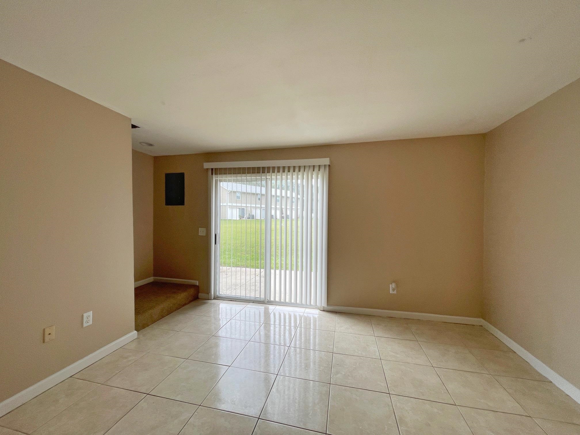 4420 Carter Road, Unit 35 St. Augustine, FL 32086 - Photo 3 of 20 a view of an empty room with a window