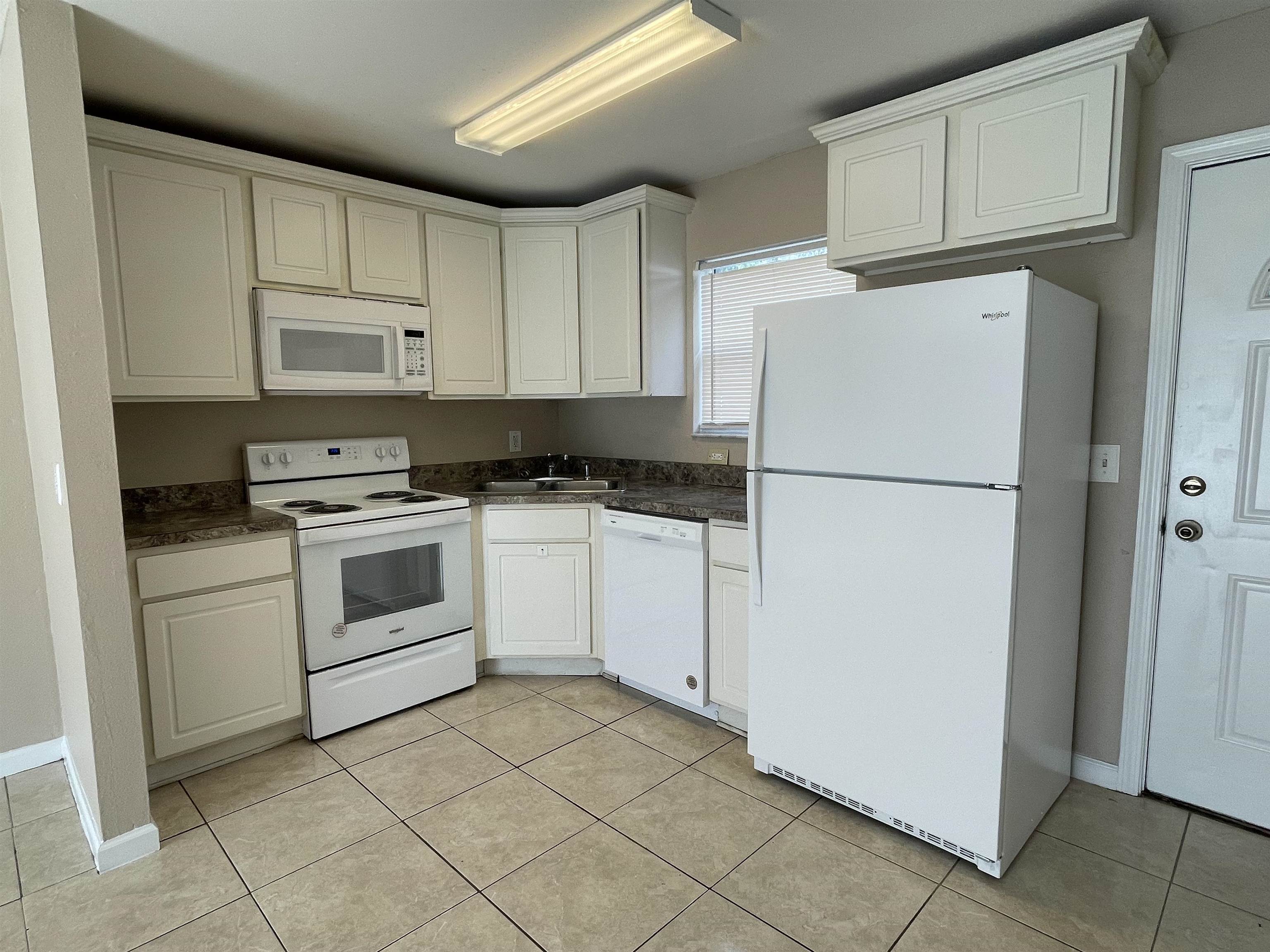 4420 Carter Road, Unit 35 St. Augustine, FL 32086 - Photo 8 of 20 a white refrigerator freezer sitting in a kitchen