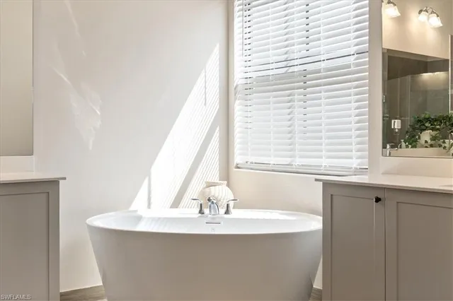 a bathroom with a sink and a window