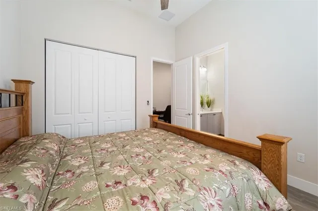 a bedroom with a bed and a mirror