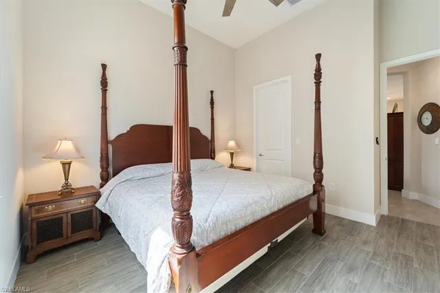 a bed room with a bed and a night stand