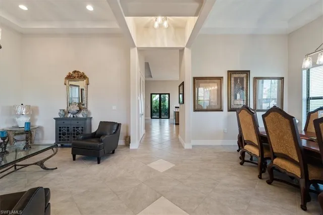 a view of a livingroom with furniture and a window