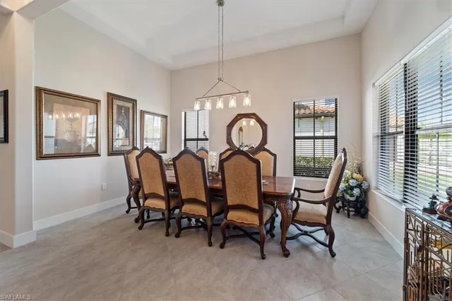 a view of a dining room with furniture and a window