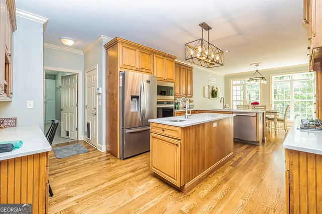 a view of a dining room with furniture wooden floor and chandelier