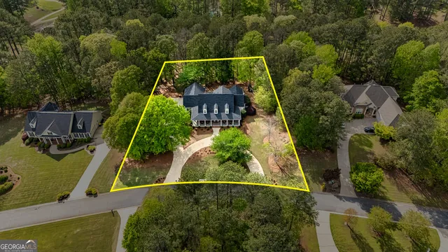 an aerial view of house with a swimming pool