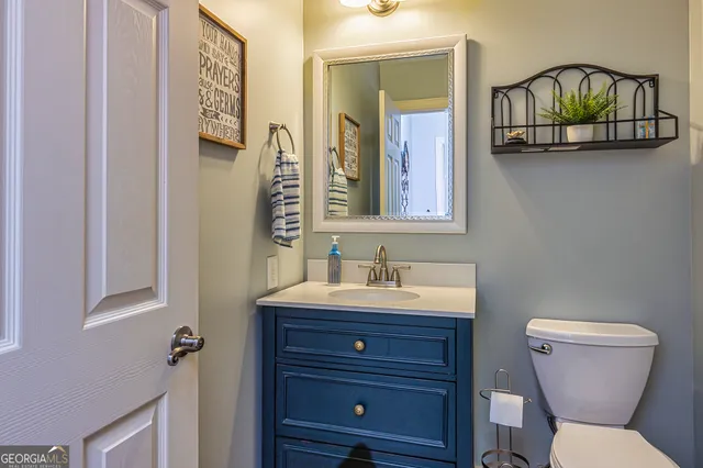 a spacious bathroom with a tub sink and mirror