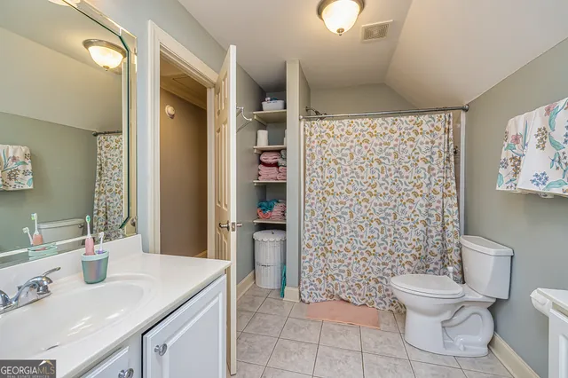 a living room with furniture a large window and gym equipment