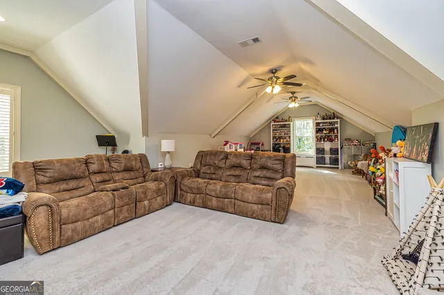 a bathroom with a sink toilet vanity and shower