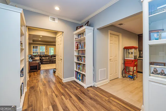a spacious bathroom with a table chairs and a chandelier