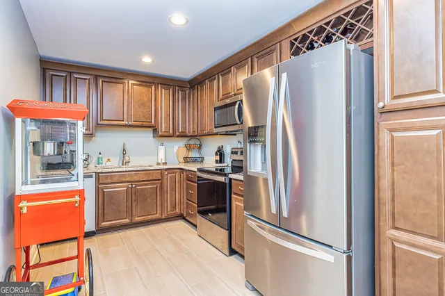 a room with lots of furniture and painting on the wall