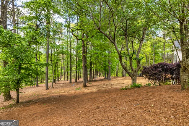an aerial view of a house with outdoor space