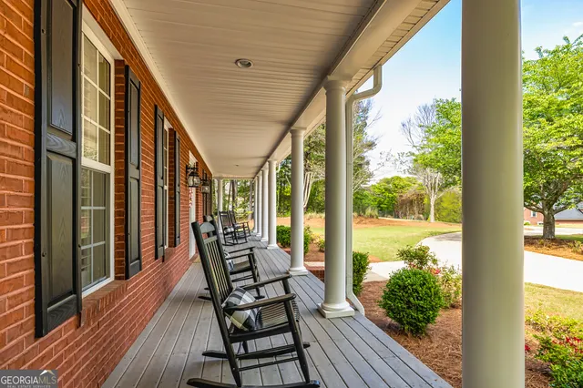 a view of an entryway with wooden floor